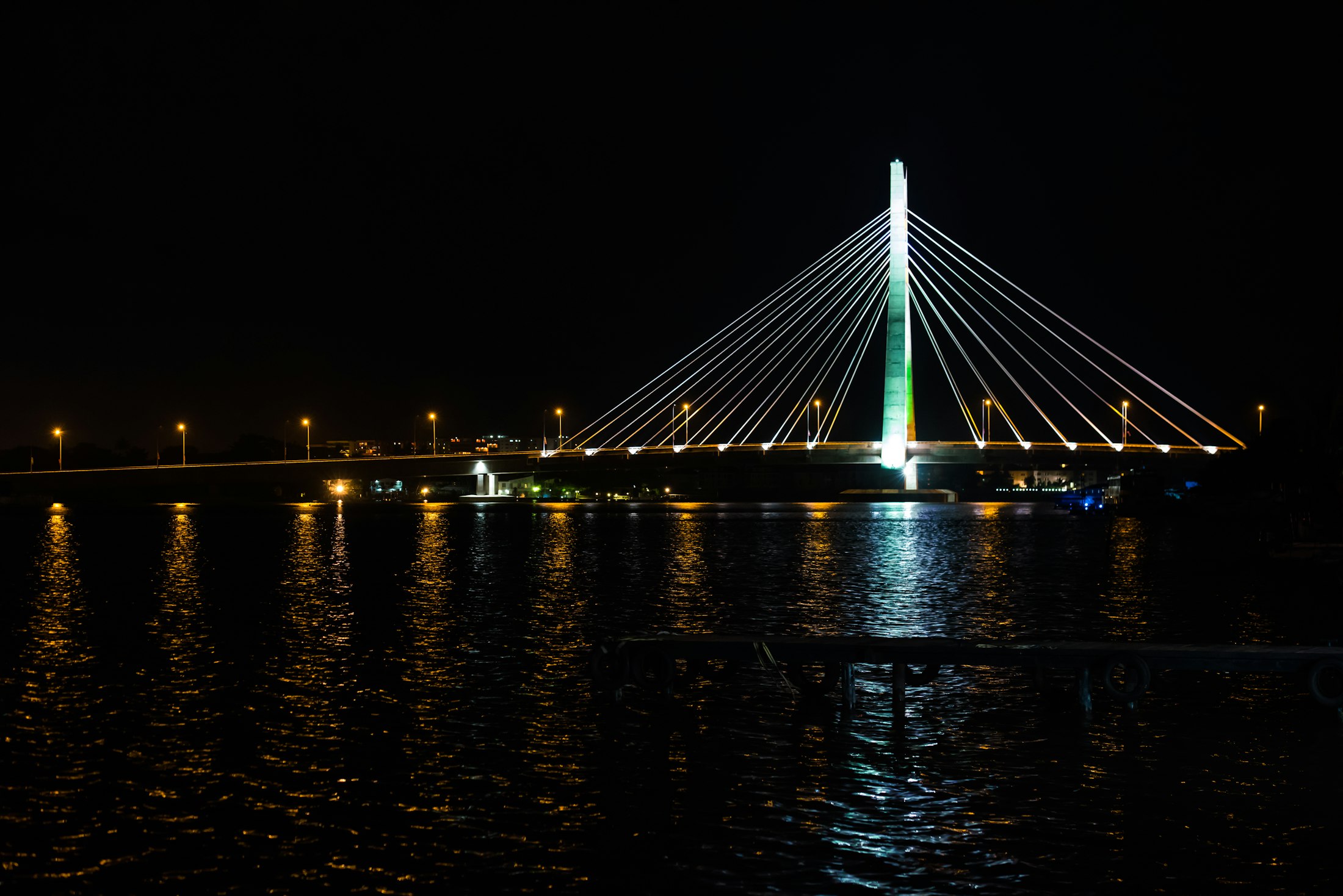 The Lekki-Ikoyi link bridge in Lagos at night, its tower lit over the water