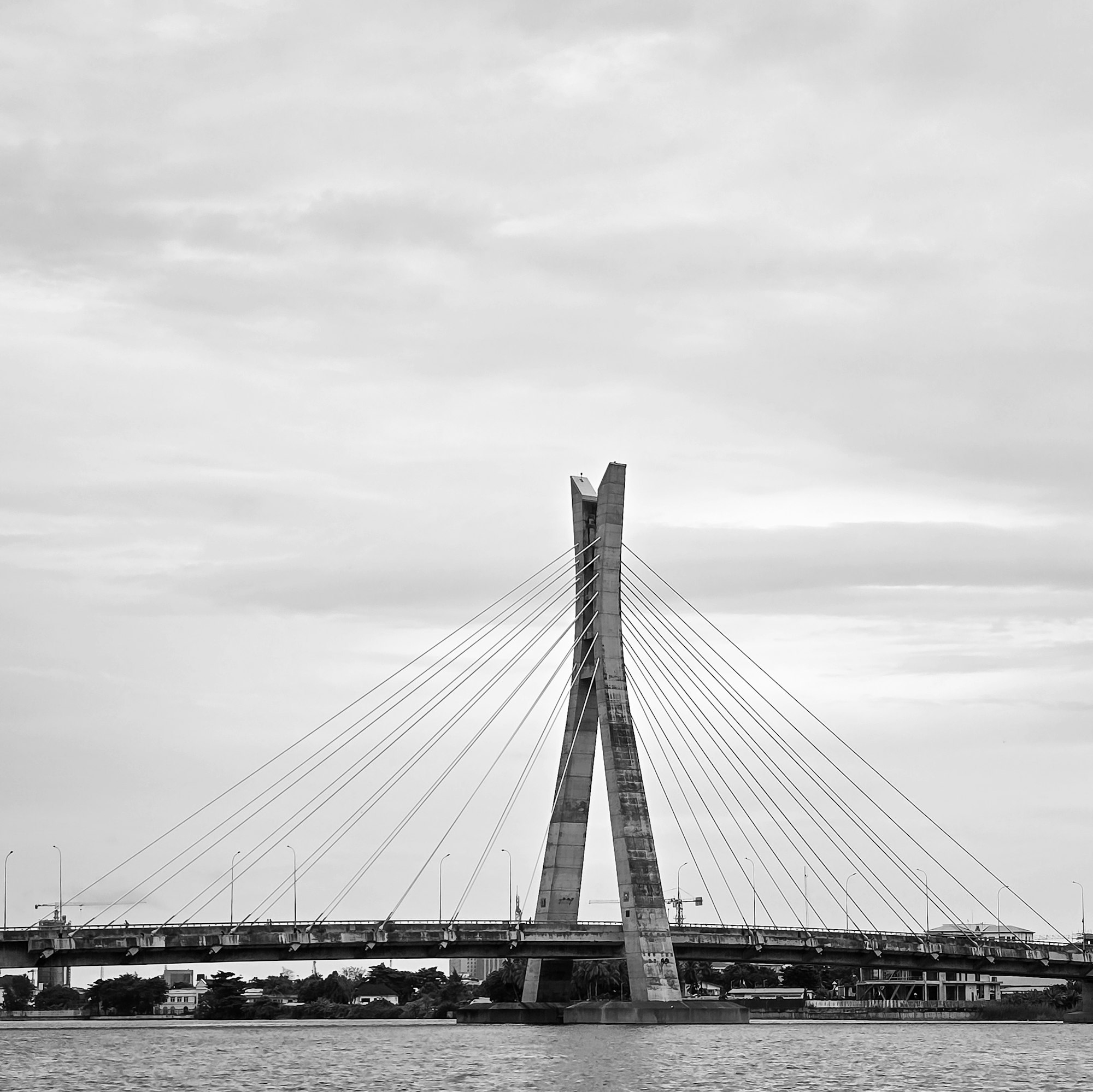 The tower of the Lekki-Ikoyi bridge in black and white